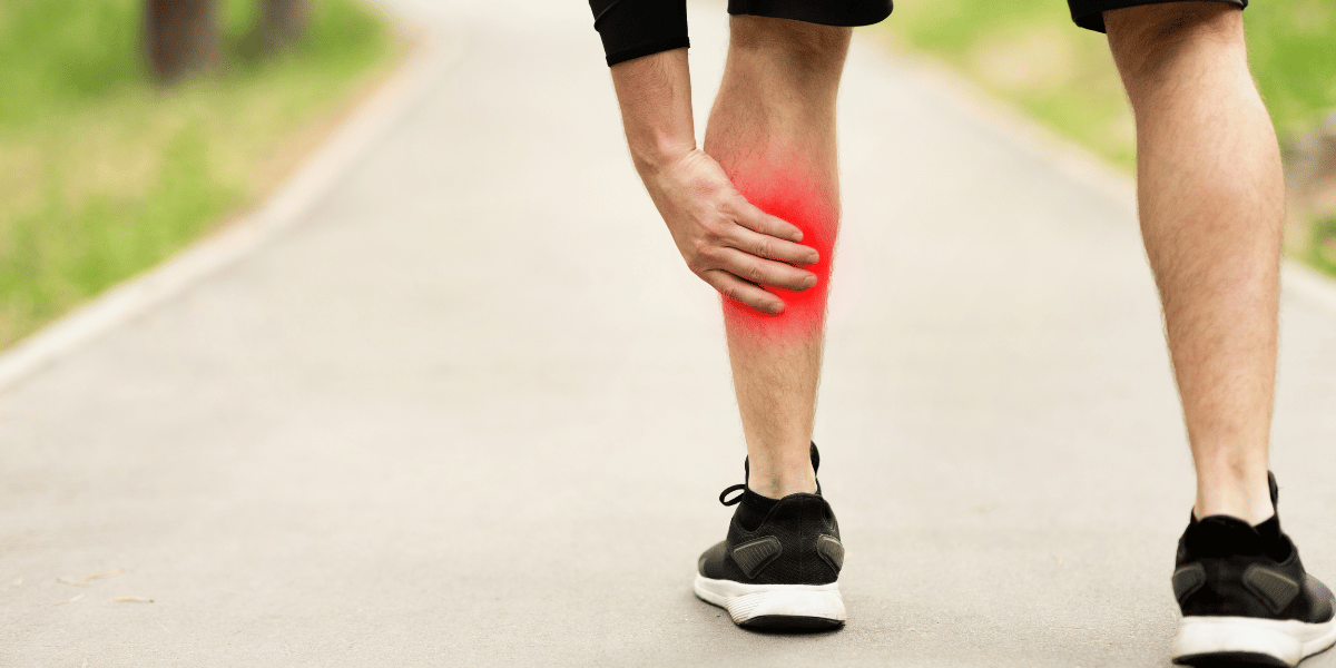 Alleviate - Man holding on to cramp in calf