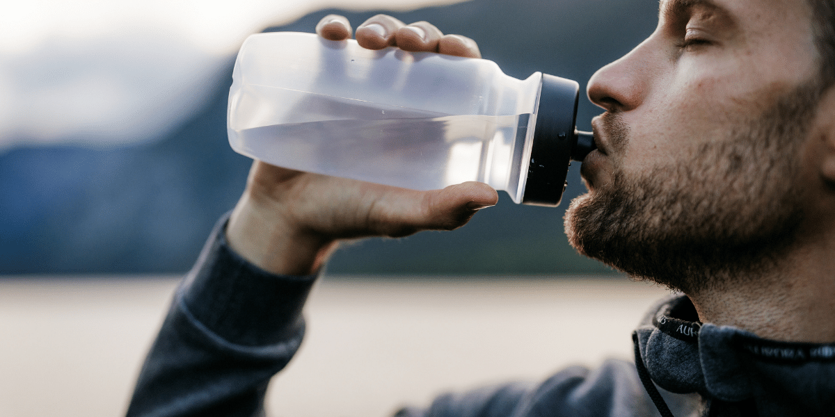 Hydration IV - Man drinking from water bottle