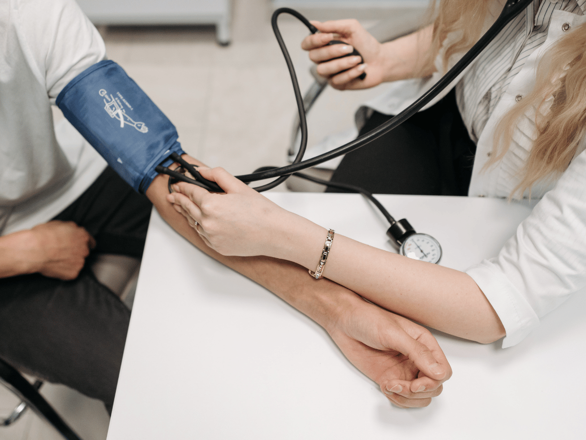 Nurse measuring taking blood pressure